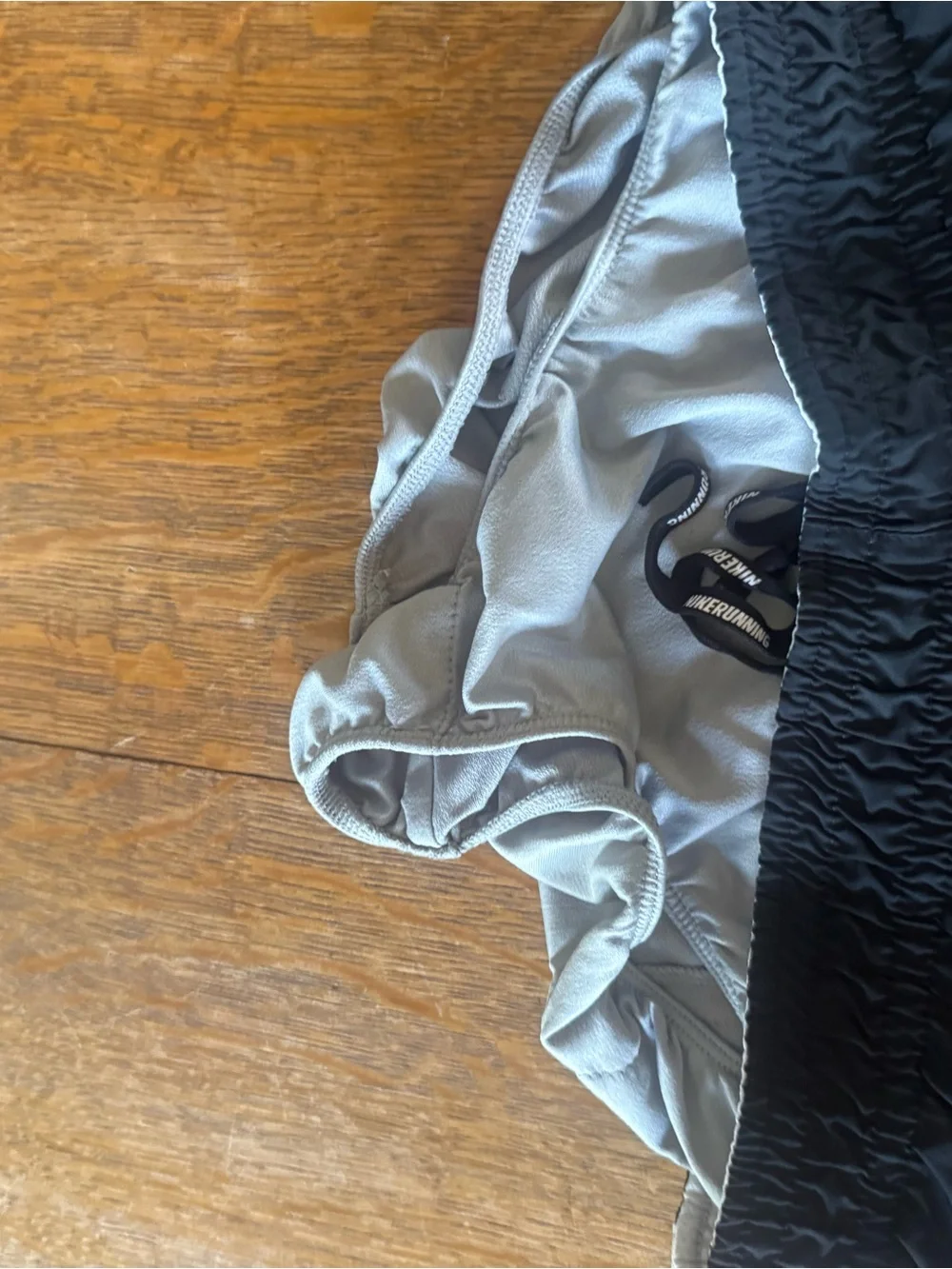 Nike Gray Athletic Shorts with White Swoosh